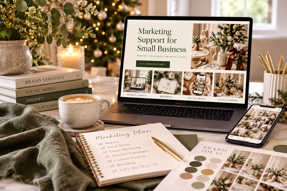 Small business marketing workspace with laptop, branding materials and social media planning